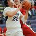 Pioneer High School's Ethan Spencer is fouled by a Bedford High School player during the second quarter at Pioneer on Tuesday, Feb. 19, 2013. Melanie Maxwell I AnnArbor.com